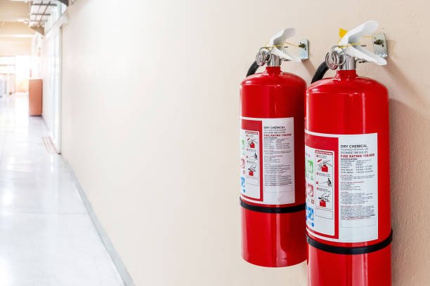 Fire extinguisher system on the wall background, powerful emergency equipment for industrial